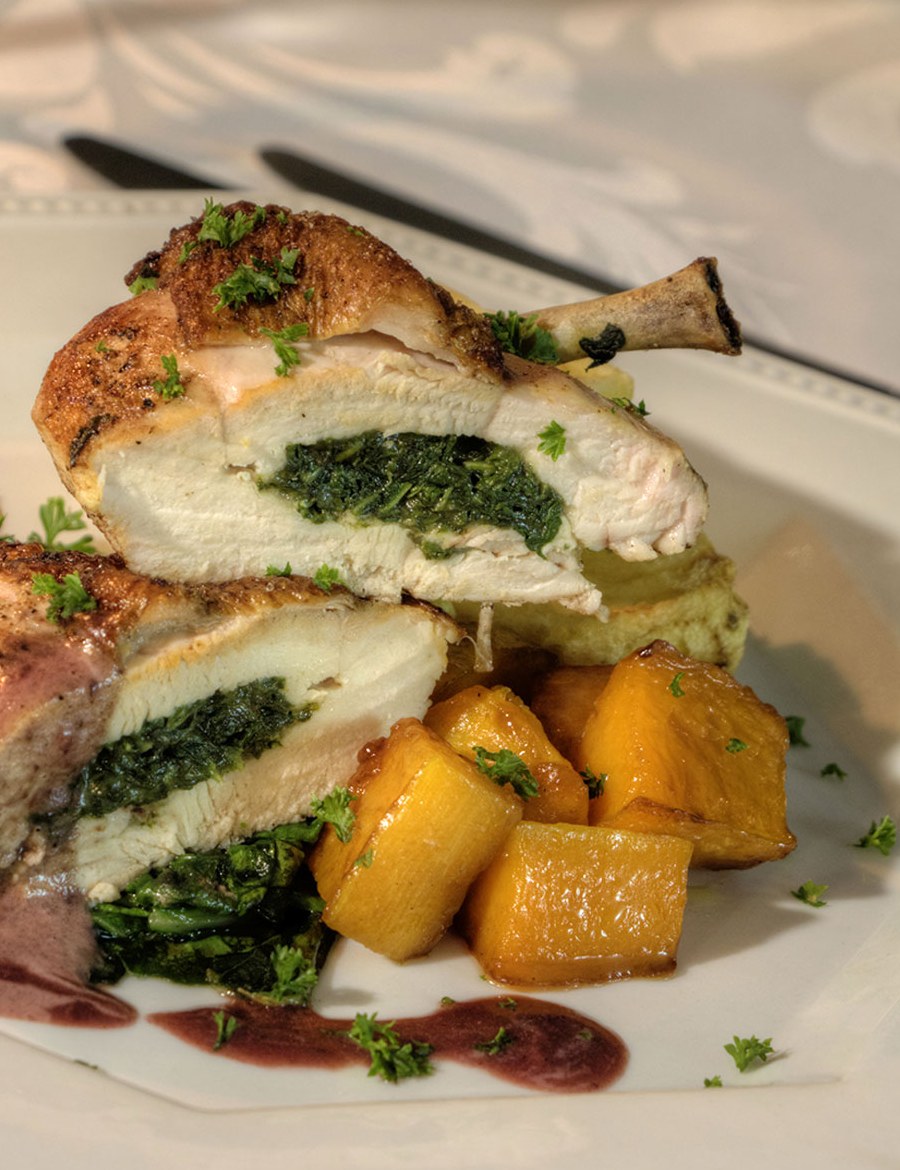 Chicken suprême with roasted vegetables and berry sauce