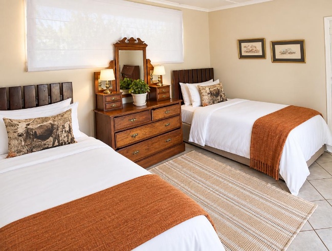 Deluxe room with two beds at Musketeers Lodge